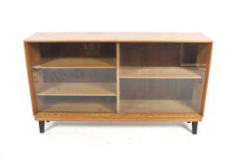 A mid-century Gordon Russell Ltd of Broadway glazed oak bookcase cabinet.