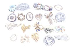 A collection of lady's brooches. Including examples modelled as flowers, hearts, bows, etc.