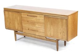 A late 20th century teak veneered sideboard.