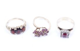Three vintage gold and gem set rings.