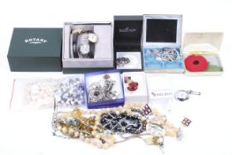 A small collection of silver jewellery and watches including various pairs of earrings.