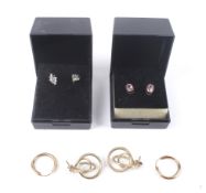 Two pairs of gold and gem set earrings plus two pairs of gold earrings.