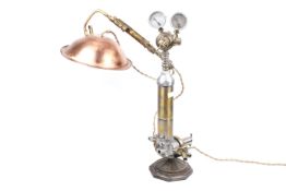 A scratch built 'Steam Punk' table lamp. Twin gauges above brass taps with a copper shade.