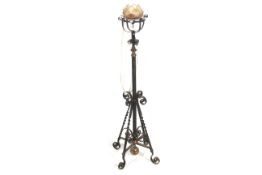 A late Victorian telescopic and wrought iron standard lamp base.