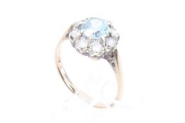A yellow metal cluster ring.