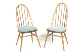 A pair of mid-century Ercol Windsor 365 chairs.