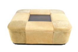 A large contemporary leather ottoman coffee table seat.