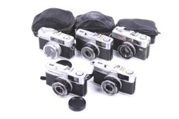 Five 35mm cameras.
