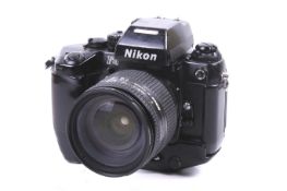A Nikon F4 35mm SLR camera. Black. Serial No. 2579784. With a Nikon AF Nikkor 24-120mm f3.5-5.
