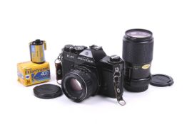 An Asahi Pentax KM 35mm SLR camera outfit. With two lenses; an SMC Pentax 55mm f1.