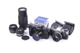 Two Olympus 35mm SLR cameras. To include an OM10 and an OM101.