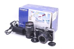 An Olympus PEN E-PL1 mirrorless digital camera outfit. With two lenses; an Olympus 14-42mm f3.5-5.