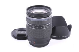 An Olympus OM System M.Zuiko Digital 14-150mm f4-5.6 mirrorless camera lens.