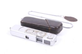 A Minox B Wetzlar sub-miniature spy camera. With a 15mm f3.5 Complan lens, strap and case.