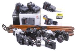 A large assortment of cameras and accessories. To include a Nikon FM2 with a Nikkor 50mm f1.