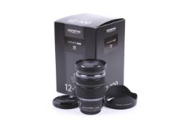 An Olympus OM System M.Zuiko Digital ED 12-100mm f4 IS Pro mirrorless camera lens.