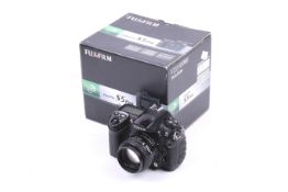 A Fujifilm FinePix S5 Pro digital SLR. With a Nikkor 50mm f1.4 lens and makers box.