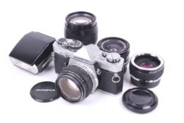 An Olympus OM-2 35mm SLR camera outfit. With three lenses; a Hoya 28mm f2.