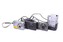 Four digital compact cameras.