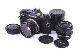 An Olympus OM-2 Spot Program 35mm SLR camera outfit. Black. Serial No. 1019990.