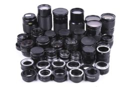 A large assortment of camera lenses and adaptors.