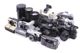 A collection of film cameras and lenses.