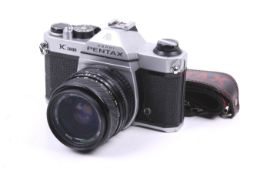 An Asahi Pentax K1000 35mm SLR camera. Serial No. 7082258. With a Photoline 35-70mm f3.5-4.