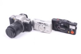 Three 35mm film cameras.
