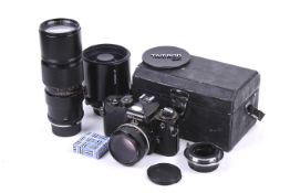 A Nikon FE 35mm SLR camera outfit. Black, serial number FE 3970535.