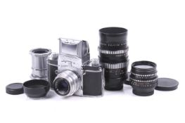 An Ihagee Dresden Exa 35mm SLR camera outfit. With three Meyer-Optik Gorlitz lenses; a 30mm f3.