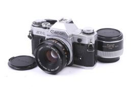 A Canon AT-1 35mm SLR camera. Chrome, serial number 394122. With a Canon FD 50mm 1.8 S.C.