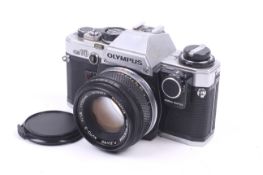 An Olympus OM10 35mm SLR camera. Serial No. 299887. With an Olympus 50mm f1.8 F.