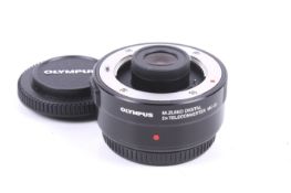 An Olympus OM System M.Zuiko Digital MC-20 2x teleconverter. With front and rear caps.