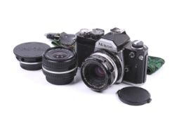 A Nikon FM 35mm SLR camera outfit. Serial number FM 2543920.