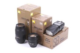 Two Nikon SLR camera lenses and a flash. To include an AF-S DX Nikkor 18-70mm f3.5-4.