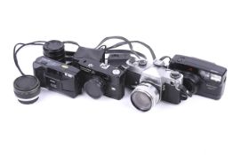 An assortment of cameras and accessories. To include a Yashica F-5 with a 55mm f1.