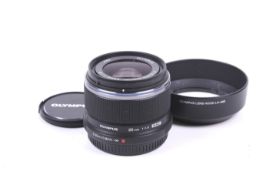 An Olympus OM System M.Zuiko Digital 25mm f1.8 mirrorless camera lens.