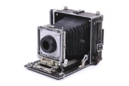 An M.P.P. Technical rangefinder press camera body. With a roll film back.