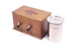 Two Kodak film developing tanks. To include a wooden Brownie and VPK tank and a metal film tank B.