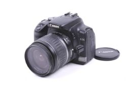 A Canon EOS 400D digital SLR camera. With a Canon 18-55mm f3.5-5.