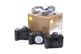 Three Nikon digital SLR camera bodies. To include a D70, D90 and D100.