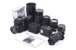A Rolleiflex SL 2000 F Motor 35mm SLR camera outfit. With five lenses; a Rollei 28mm f2.