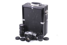 A Minolta X-500 35mm SLR camera outfit. With three lenses; a Minolta 24mm f2.8 MC W.
