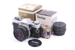 An Olympus OM-1N 35mm SLR camera. Chrome. Serial No. 1708430. With a Sunactinon 28mm f2.