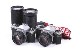 A Pentax ME Super 35mm SLR camera outfit. With two bodies each with SMC Pentax-M 50mm f1.7 lenses.