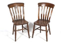 A pair of early 20th century slate back Windsor chairs.