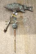 A vintage metal weather vein modelled as a fish.