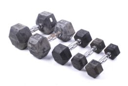 A set of five dumbells. Including 2x 2kg, 1x 5kg, 1x 10kg & 1x 15kg.
