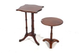Two mahogany tripod side tables.