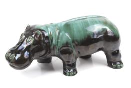 A Blue Mountain glazed terracotta figure of a hippopotamus.